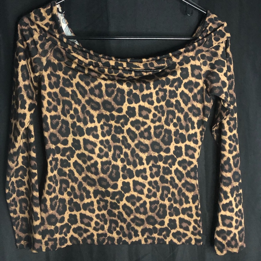 Off the shoulder cheetah print shirt.